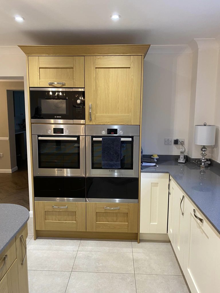 Expert decorators transforming an kitchen appliance space in Milton Keynes